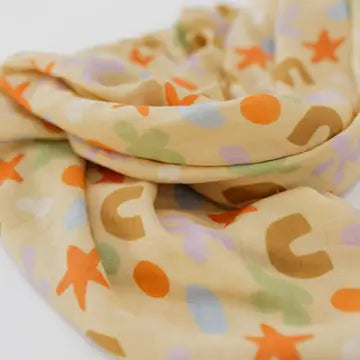 Playtime Whimsy 🍀🌟🫟🟠 Muslin Swaddle